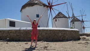 Gap 360 traveller in front of windmills in Mykonos