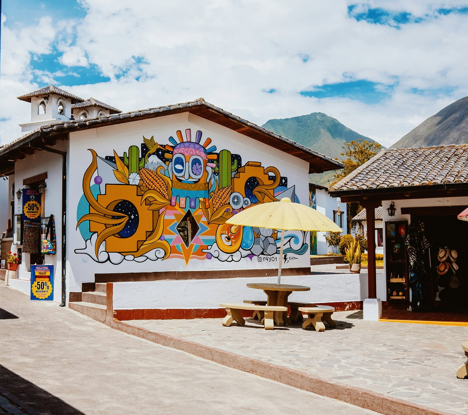 Building with colourful mural on the side of it in Quito
