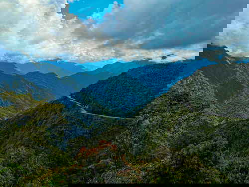 The winding Death Road and surrounding mountains in Bolivia