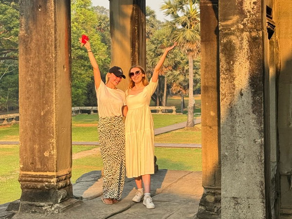Travellers at Angkor Wat at sunrise in Cambodia