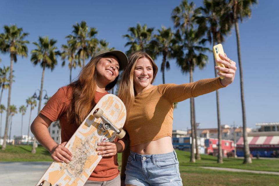 Friends taking selfie on venice beach