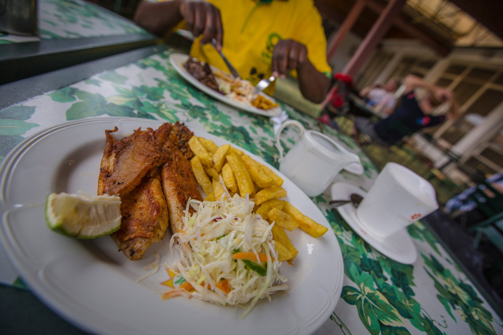 Plate of meat, salad and chips at a local African cafe
