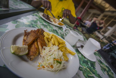 Plate of meat, salad and chips at a local African cafe