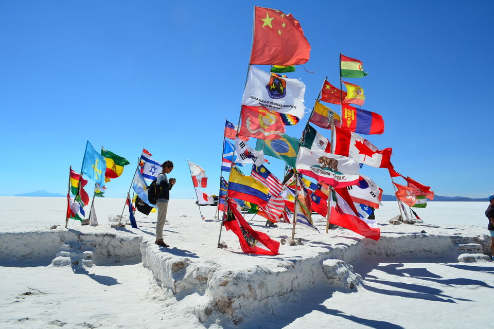 World Flags in salt flats in Uyuni in Bolivia