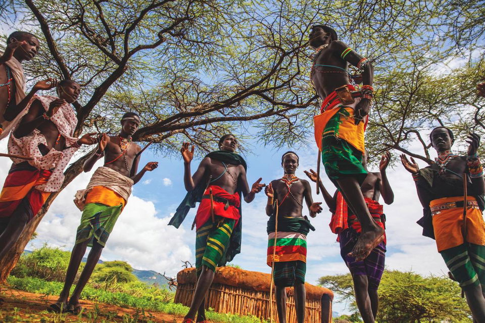 Maasai people clapping and dancing