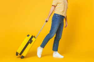 Traveller with a yellow suitcase
