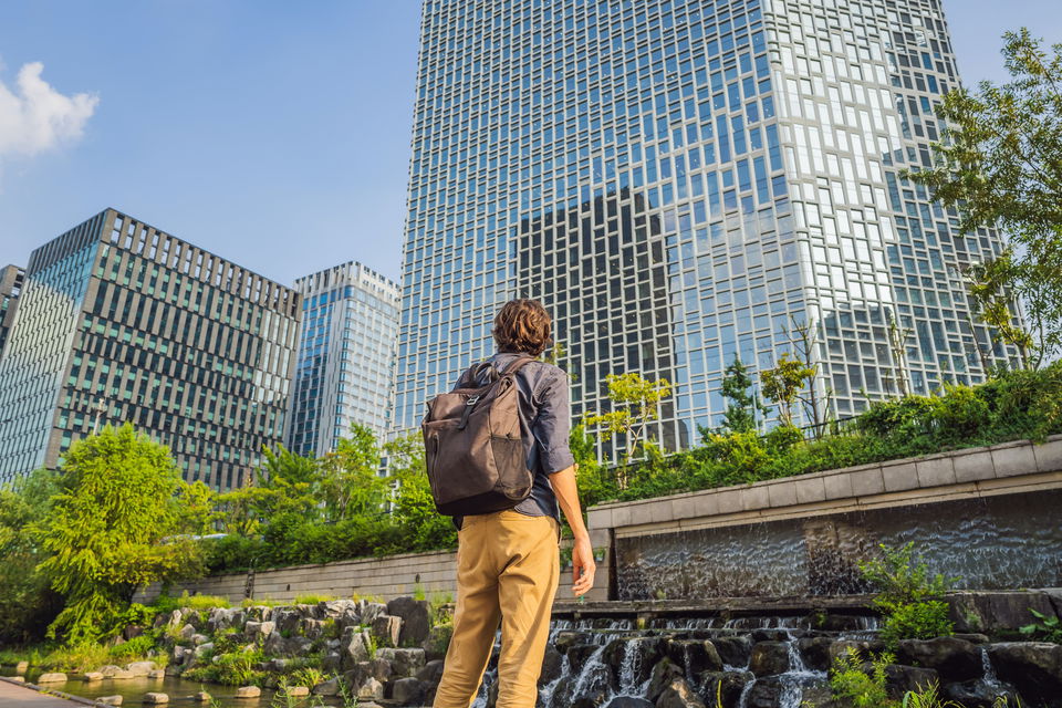 Man looking over Garden fountain in Seoul, South Korea