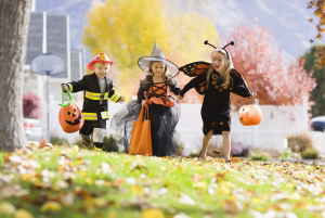 Kids in halloween costumes going trick or treating