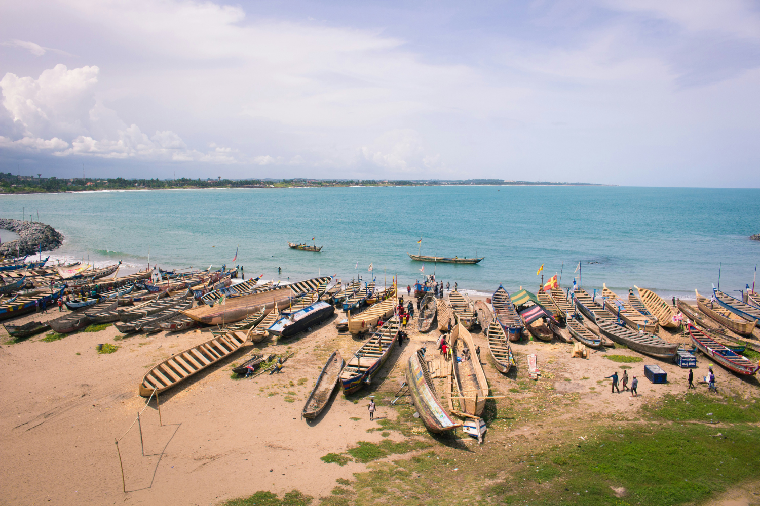 Fisherman boats along the shoreline in Ghana