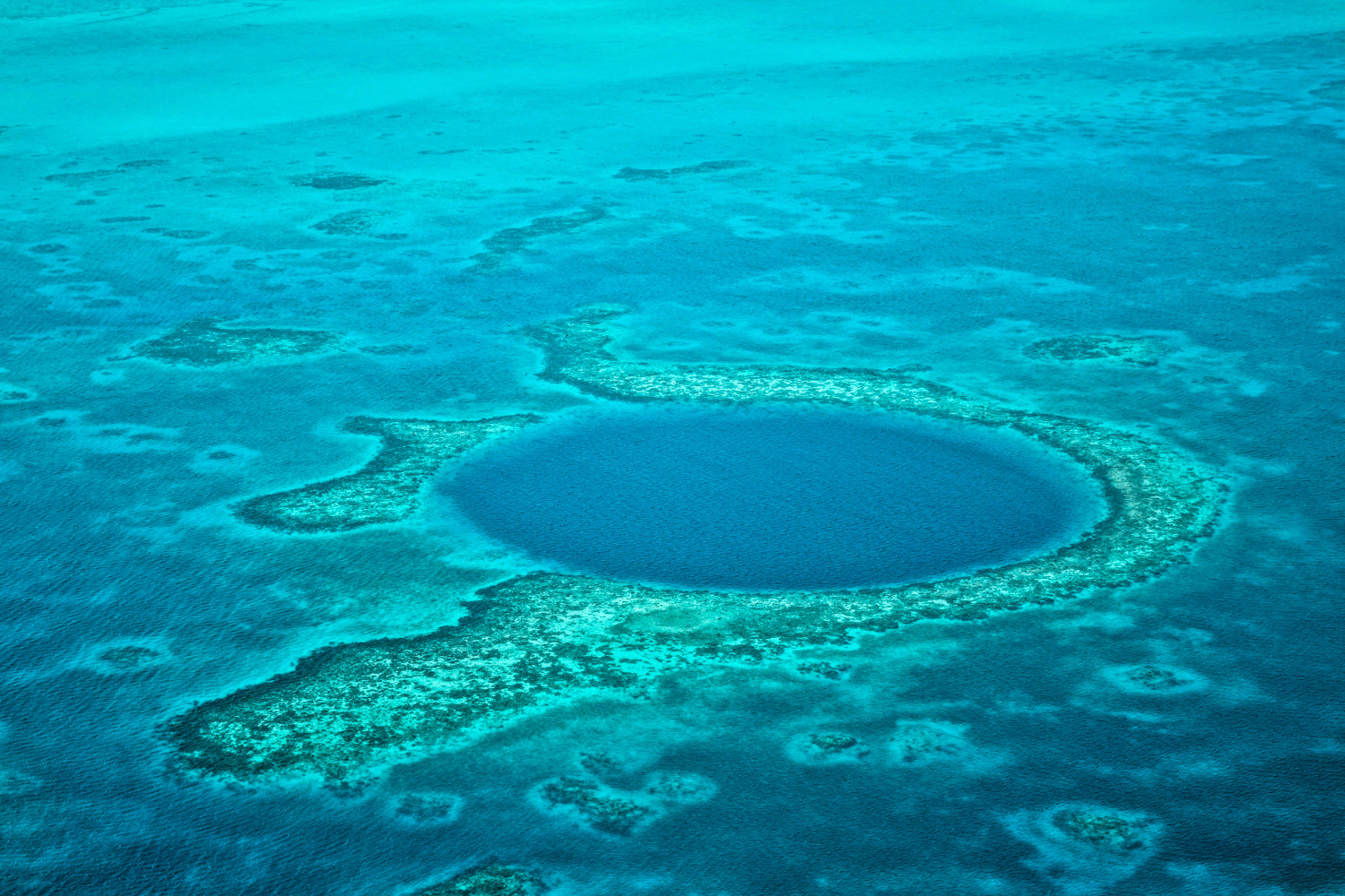 Scenic flight over the Great Blue Hole, a sink hole in Belize 