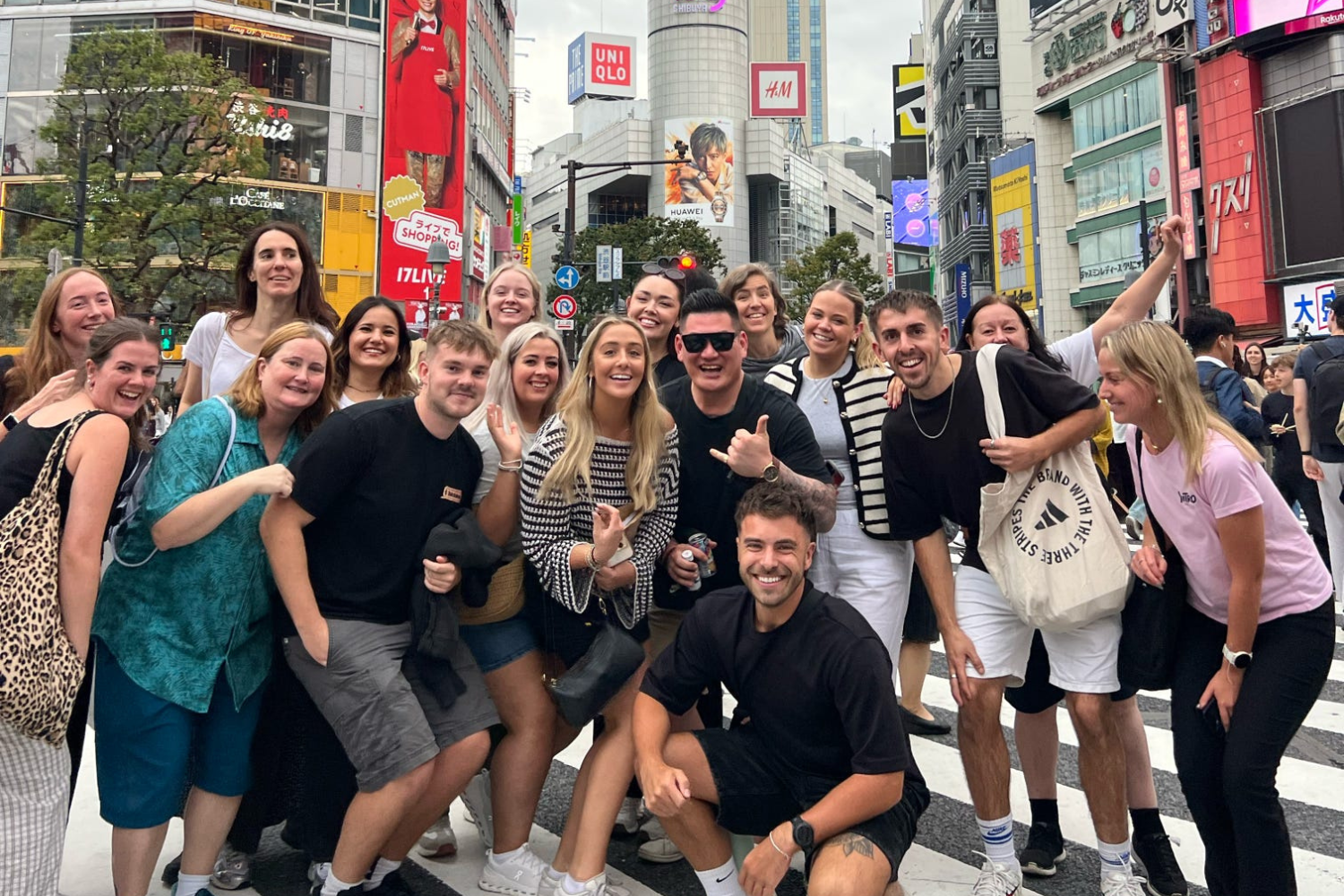 Group of travellers at Shibuya Scramble crossing in Tokyo in Japan