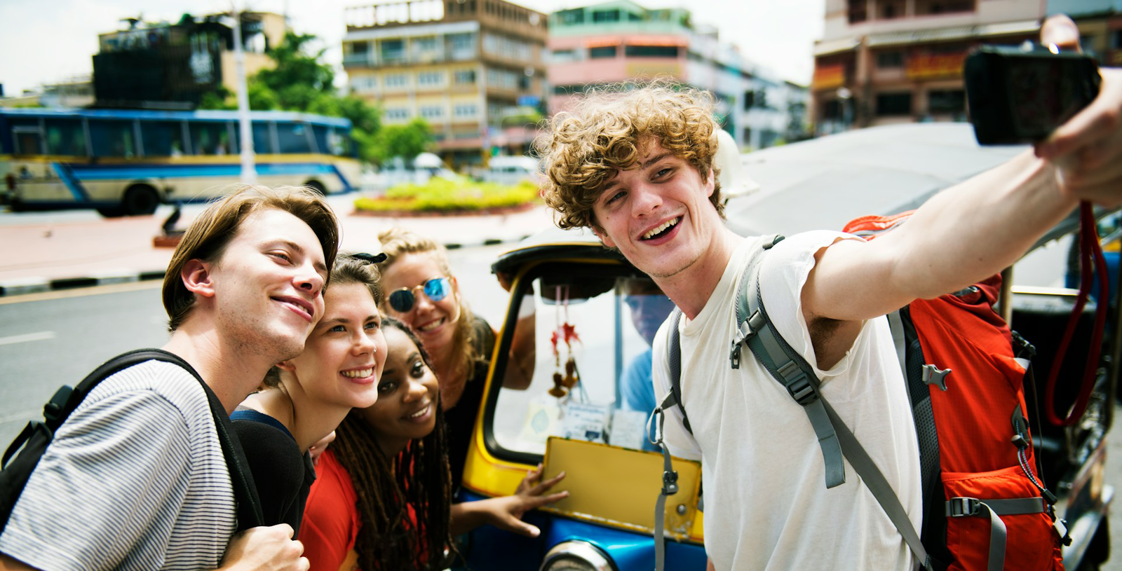 Group travellers in Thailand with Tuktuk