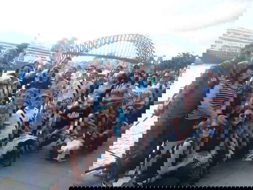 Gillian with fellow travellers in front of Sydney Harbour Bridge