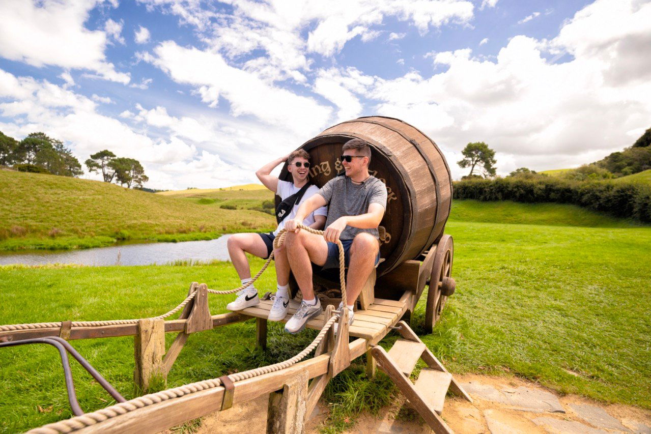 Travellers on hobbiton carriage in New Zealand
