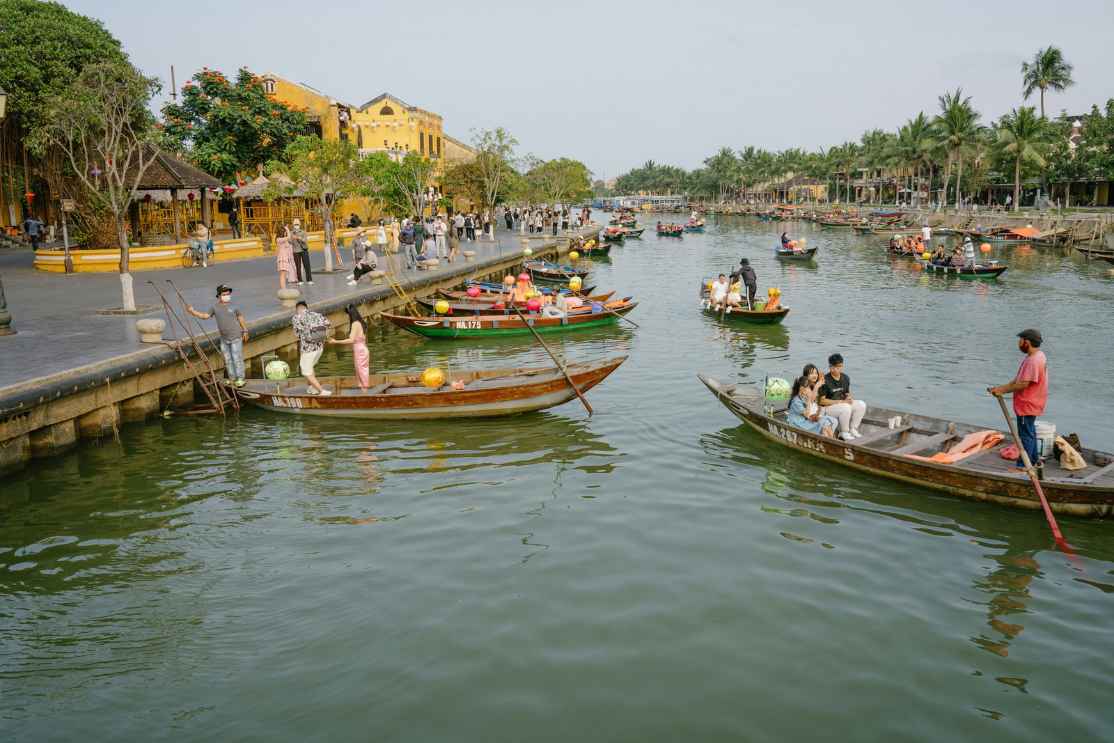 People in boats on a river in Hoi An, Vietnam