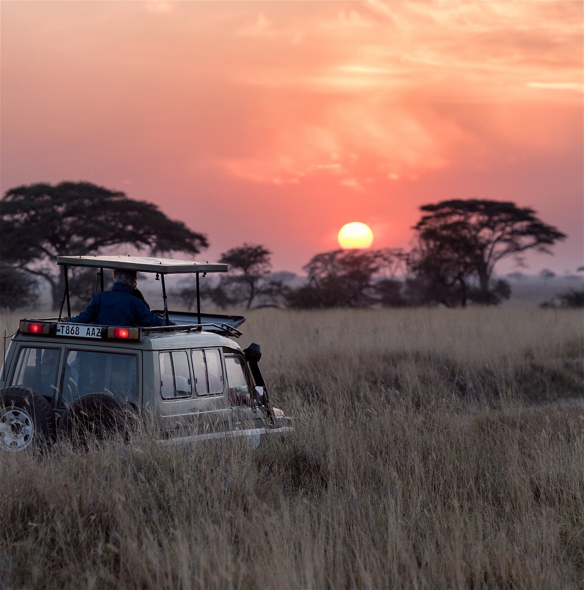 safari truck at sunset in Kenya National Park