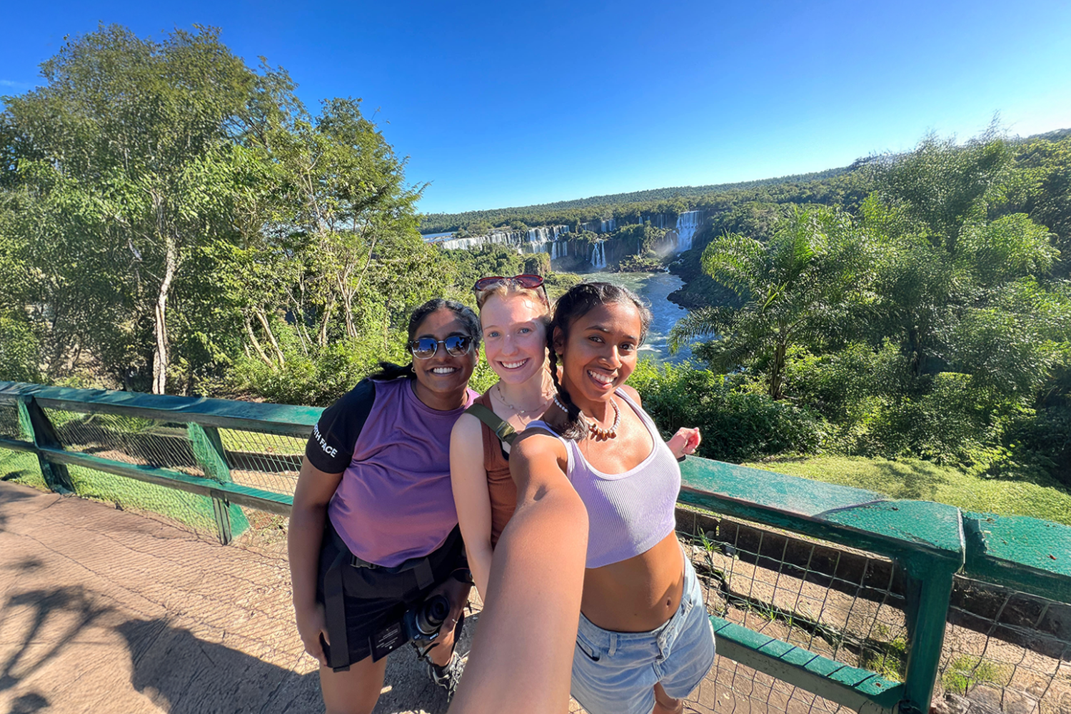 Group of travellers in front of Iguazu Falls in Brazil