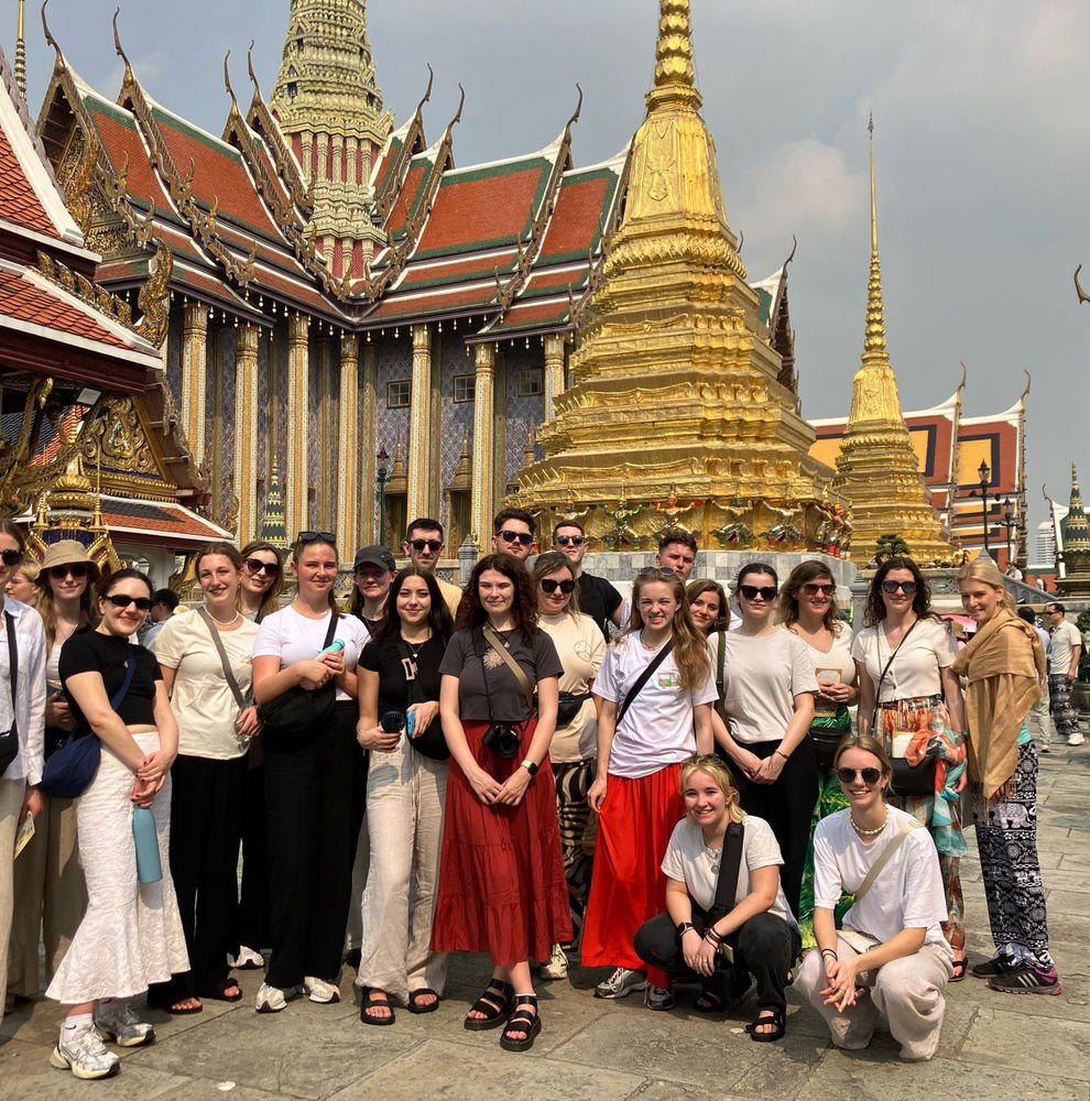 Group travellers at temple in Bangkok Thailand