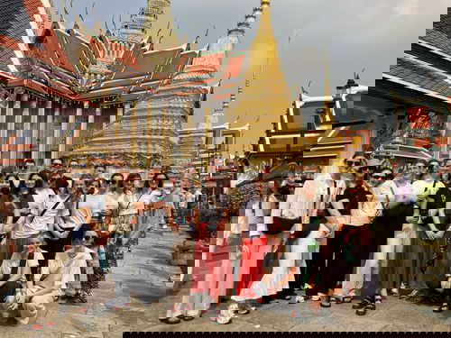Group travellers at temple in Bangkok Thailand