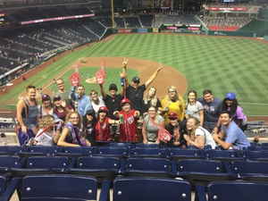 Travellers in the stands at a baseball match