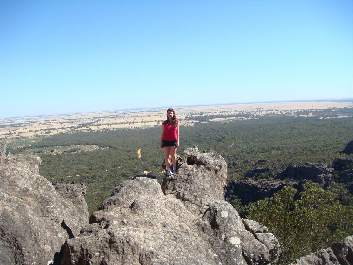 A traveller standing on a rock in the Blue Mountains, Australia