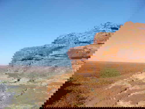A cliff face of red rocks in outback Australia
