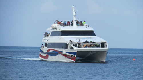 A boat full of people in the ocean in Thailand