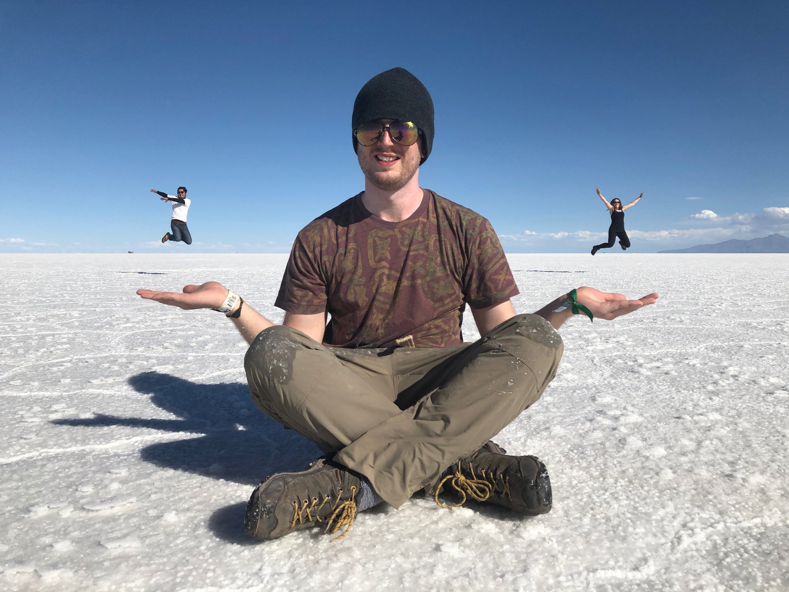 People jumping at Uyuni Salt Flats, Bolivia