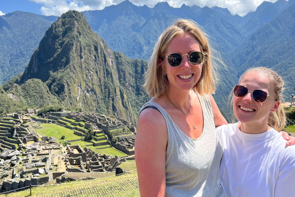 Group travellers at viewpoint of Machu Picchu in Peru