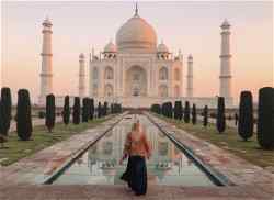 Traveller in front of the Taj Mahal, India 