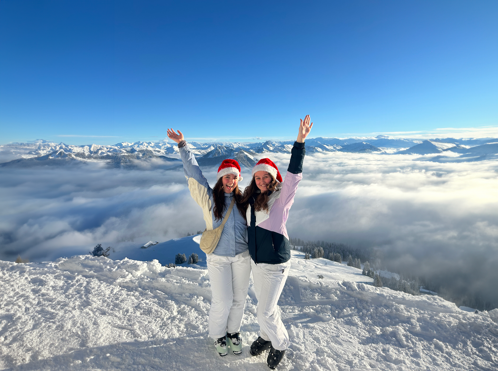 Two travellers with christmas hats on in Austria
