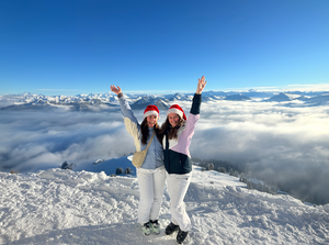 Two travellers with christmas hats on in Austria