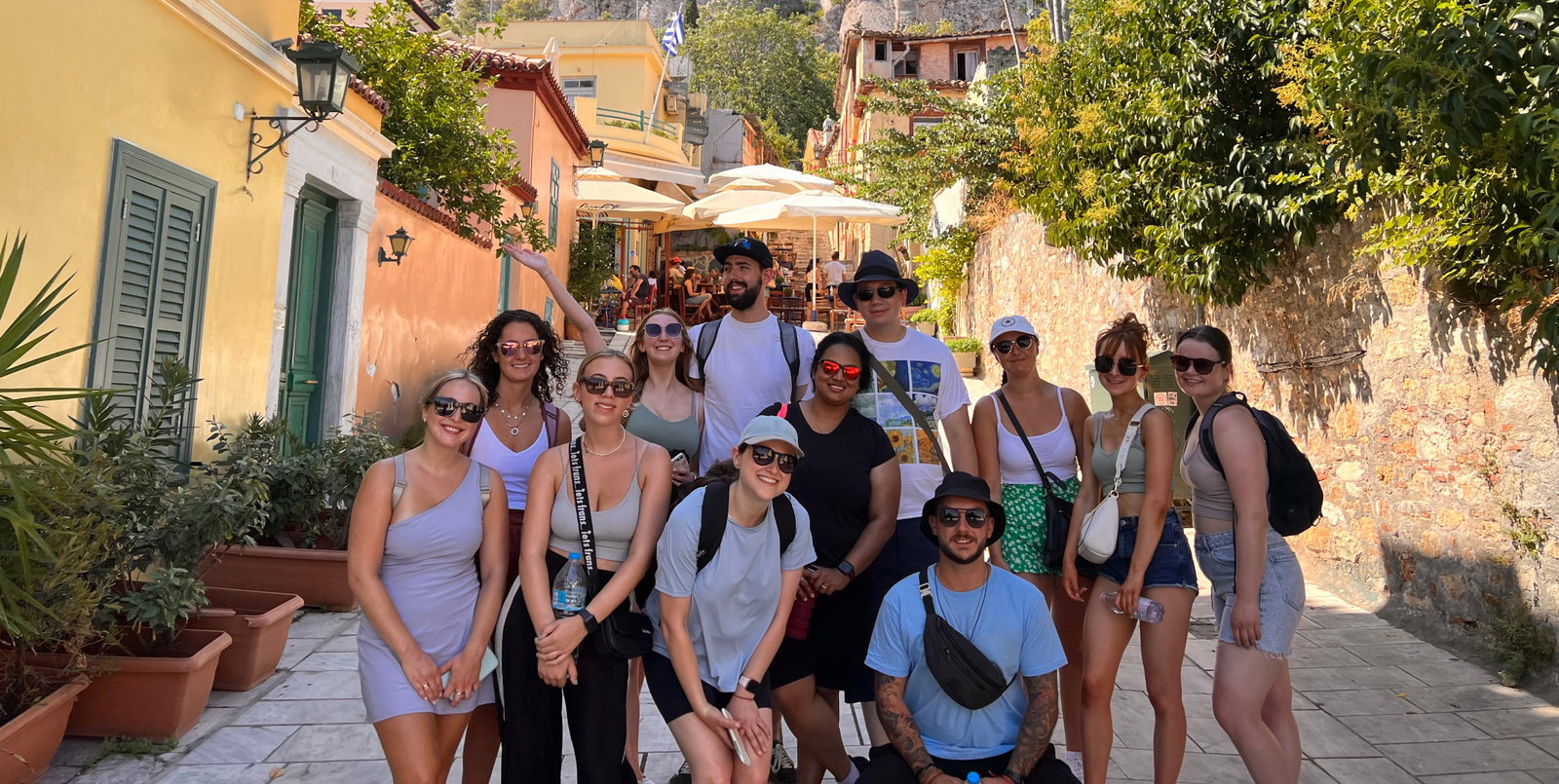 Group of travellers down street in Athens, Greece