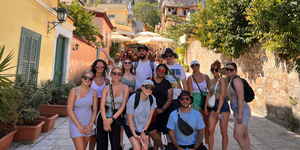 Group of travellers down street in Athens, Greece