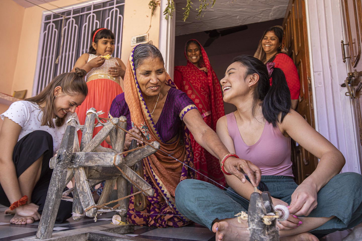 Group of travellers in tordi at weaving class india