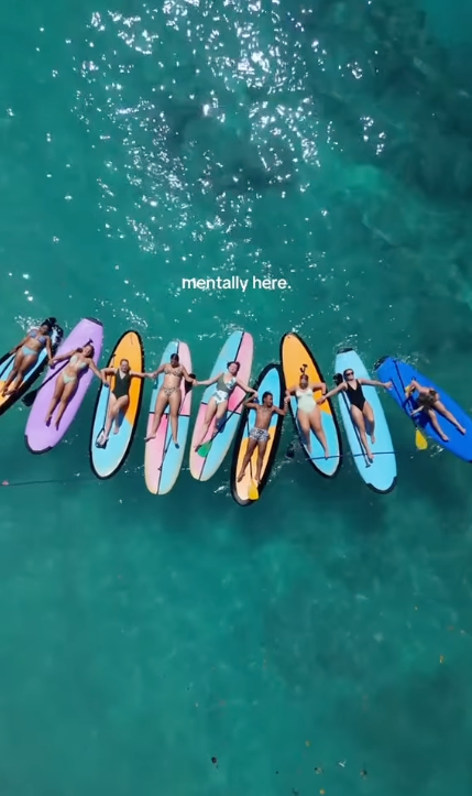 group travellers on surf boards in Bali Indonesia