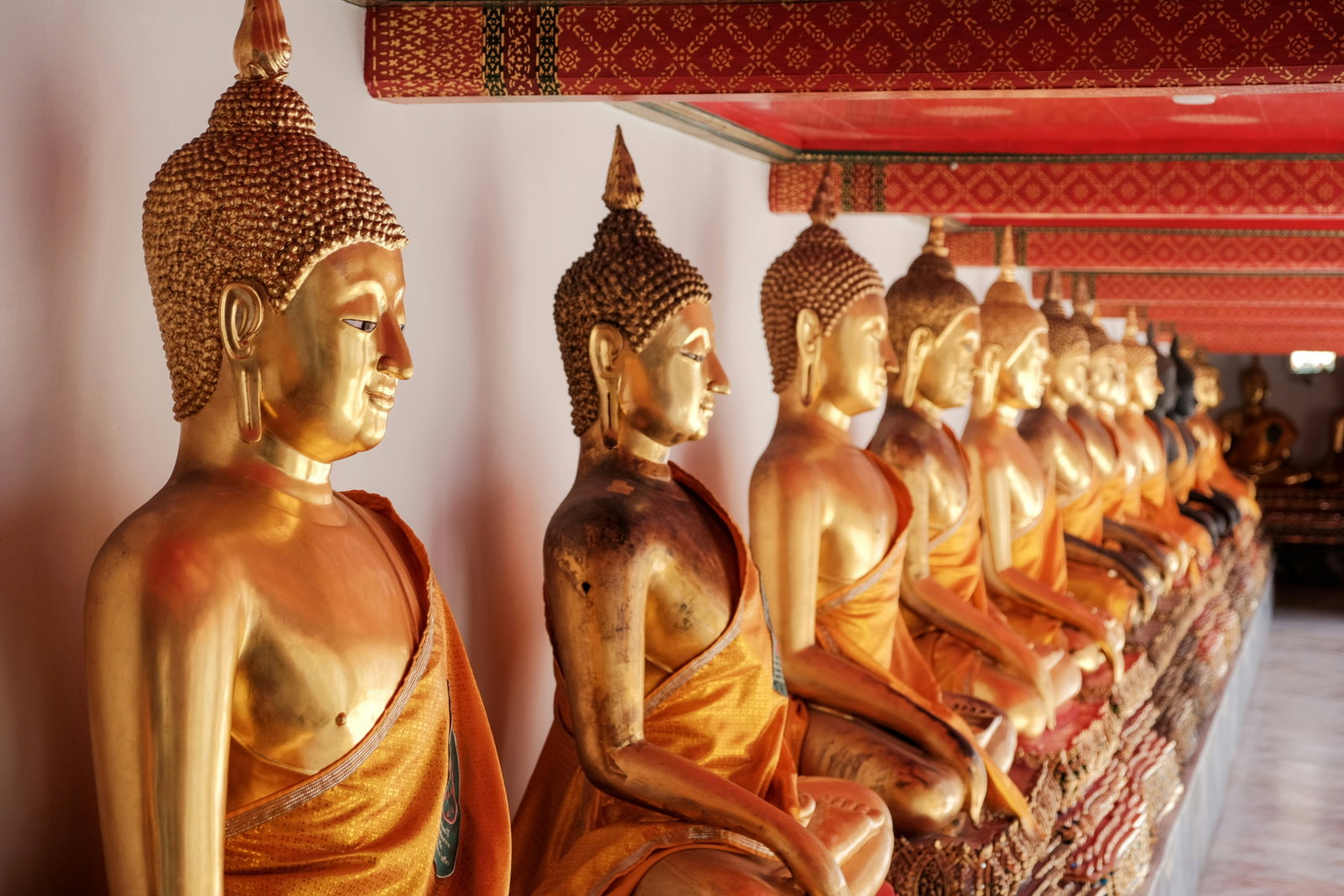 Golden Buddha statues in Wat Pho temple in Thailand