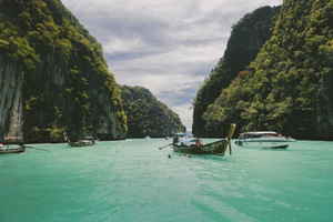 Boats in water between islands 