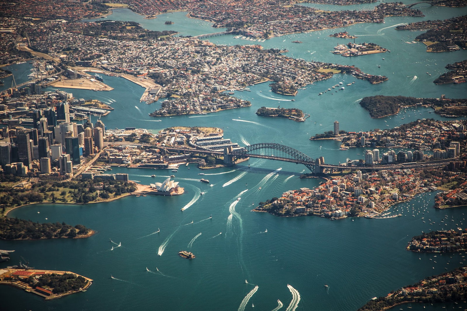 Aerial view of the Sydney Harbour Bridge and surrounding bay and city