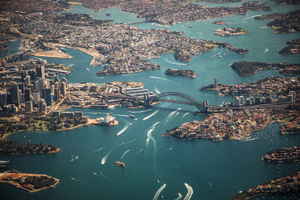 Aerial view of the Sydney Harbour Bridge and surrounding bay and city