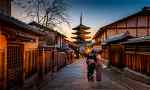 Kyoto street with geishas and temple
