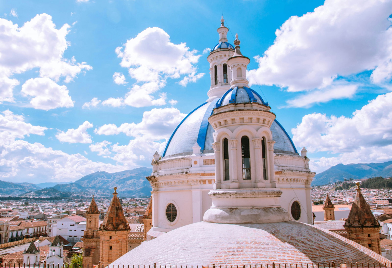 White dome rooftop in front of mountain view in Cuenca, Ecuador