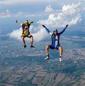 Two travellers skydiving