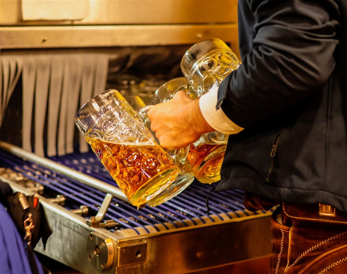 A man pouring Maßes of beer at Oktoberfest in Munich, Germany.