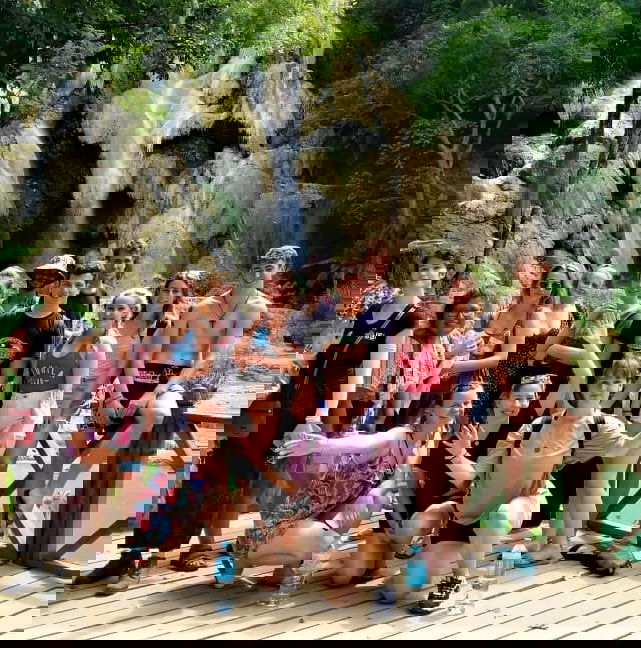 Group travellers at Kuang si waterfall in laos