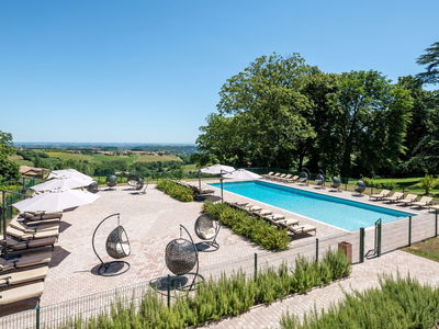 French chateau accommodation during the day with swimming pool