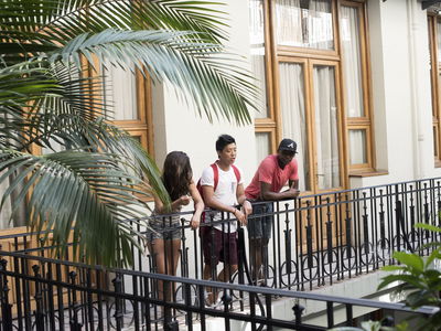 People looking over balcony in south america