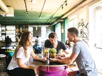 Travellers sitting in bar at hostel in europe