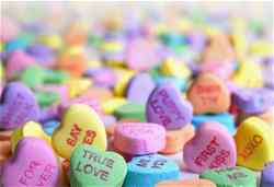Love heart shaped sweets with messages printed on