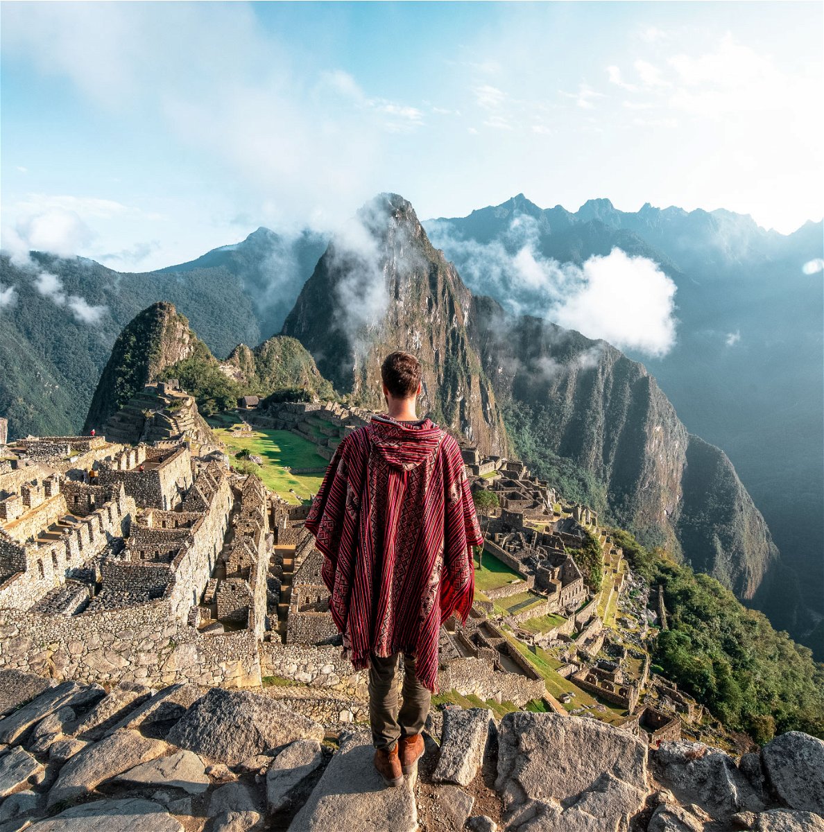 Traveller looking over Machu Picchu viewpoint in Peru